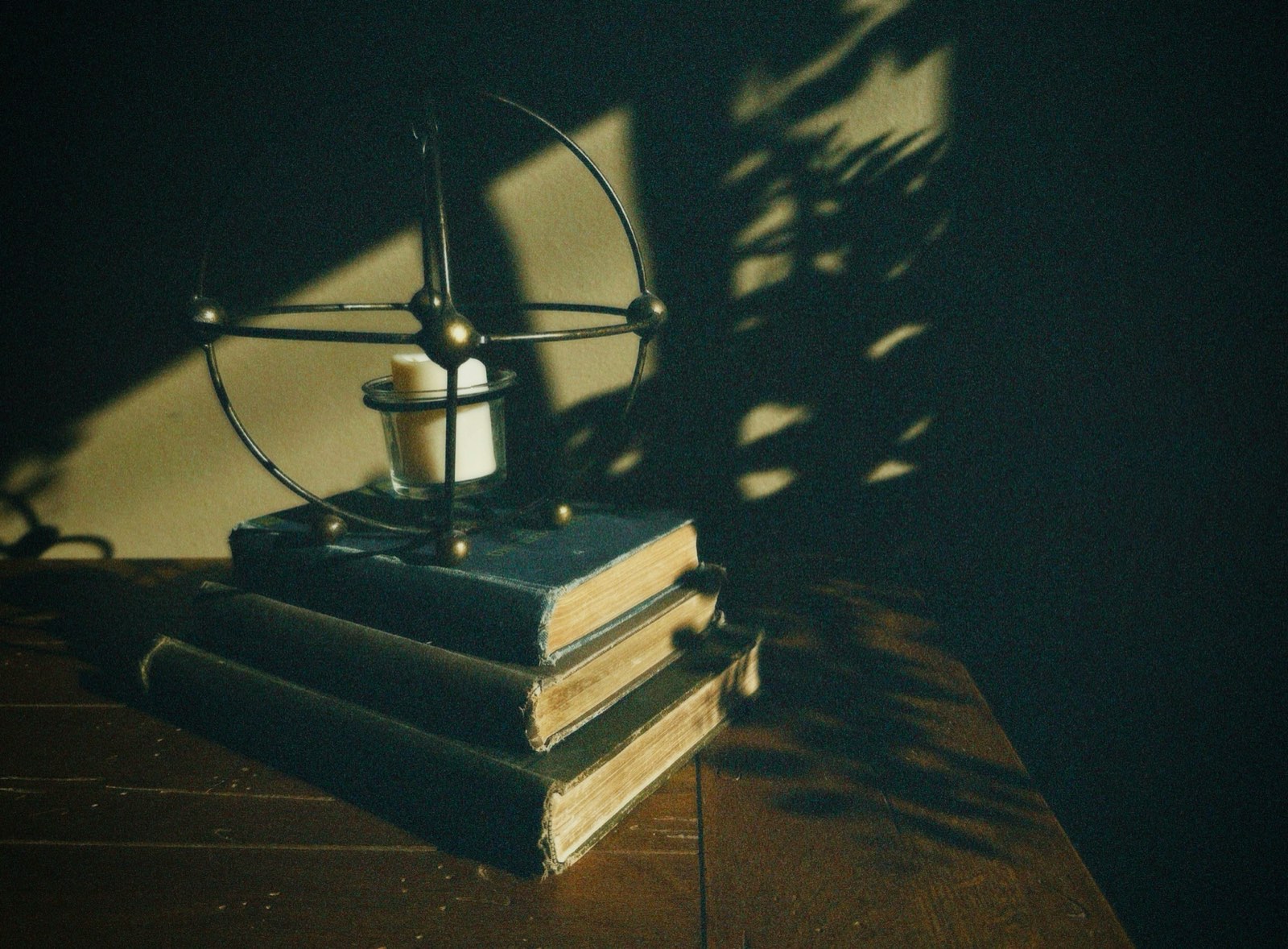 A stack of books on a wooden table