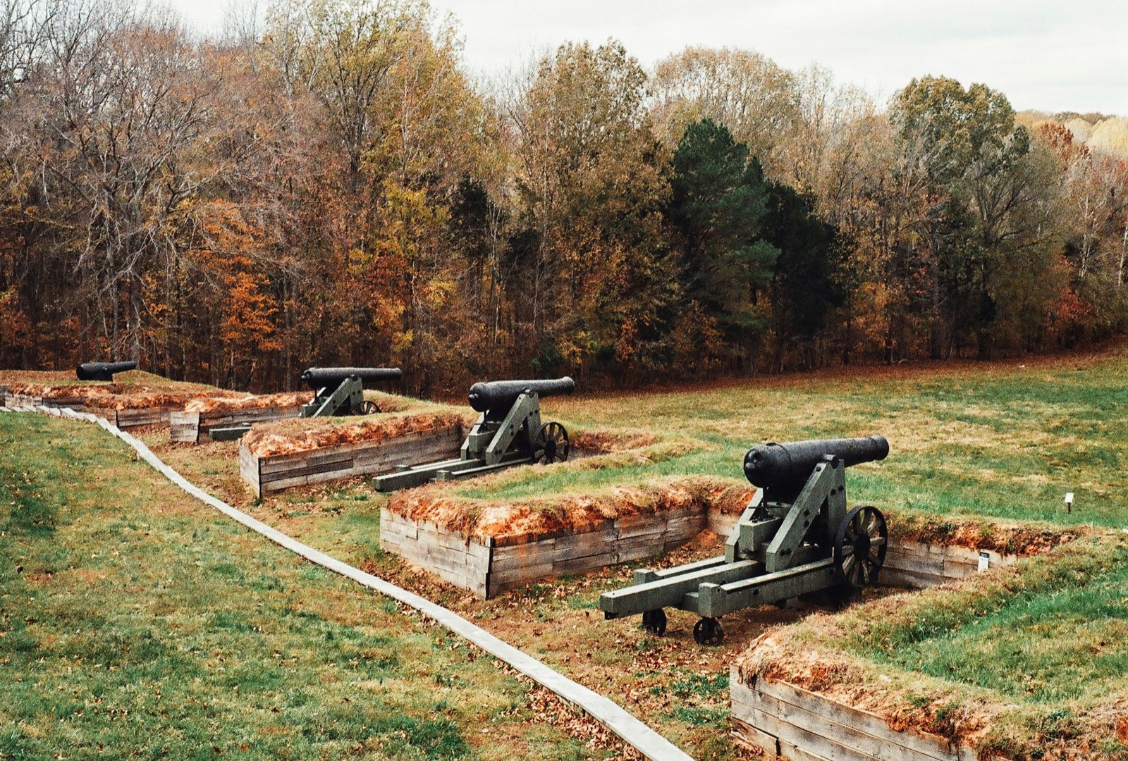 Civil War era cannons on a grassy battlefield