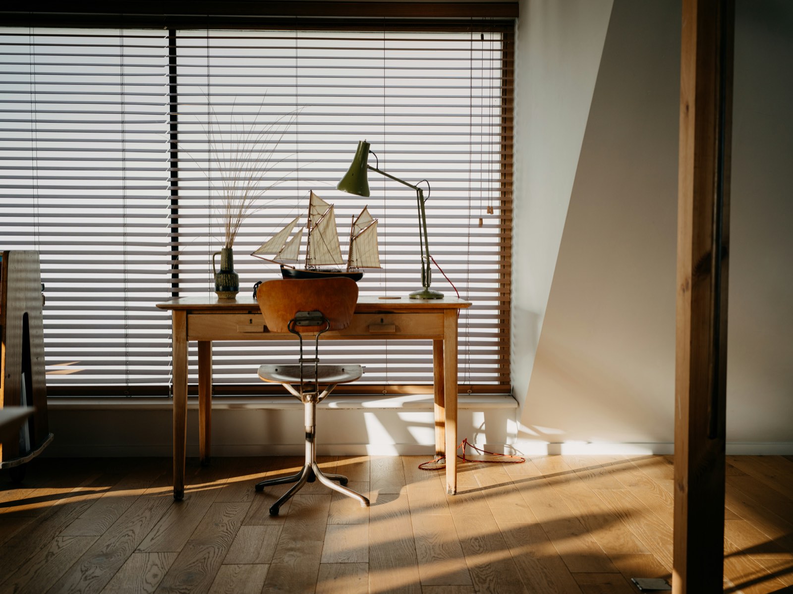 A quiet desk by a window, set up for independent study