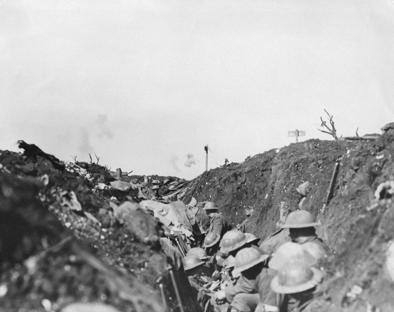 Archival black and white photo of soldiers in a WWI trench